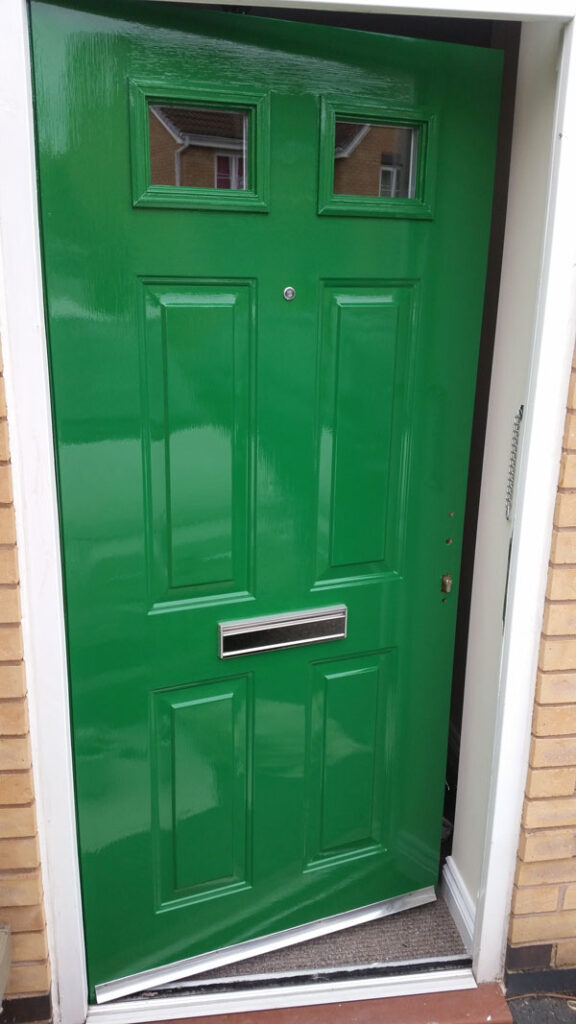 Painted gloss green exterior door, Pride Park, Derby