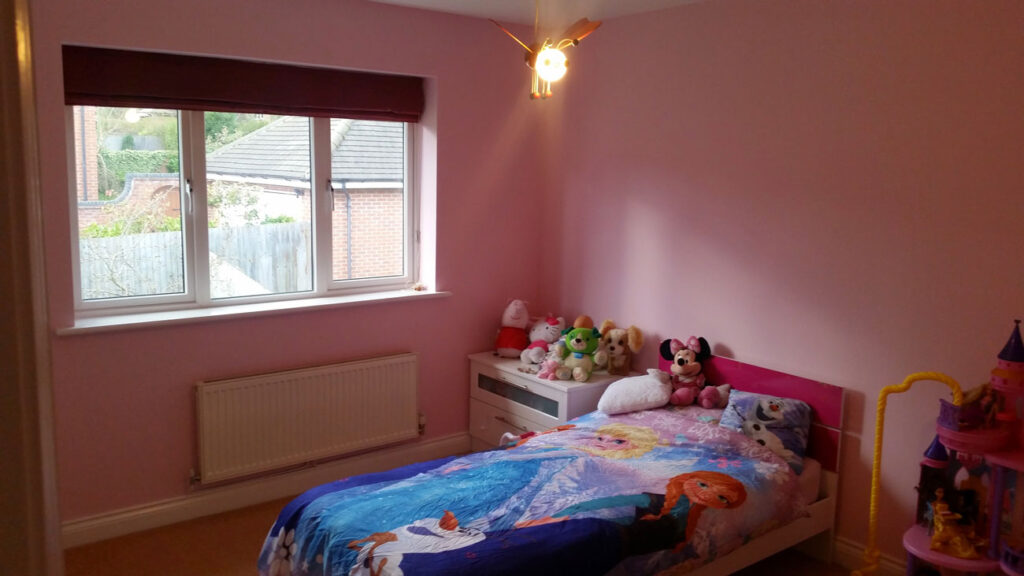 Pink painted kids' room