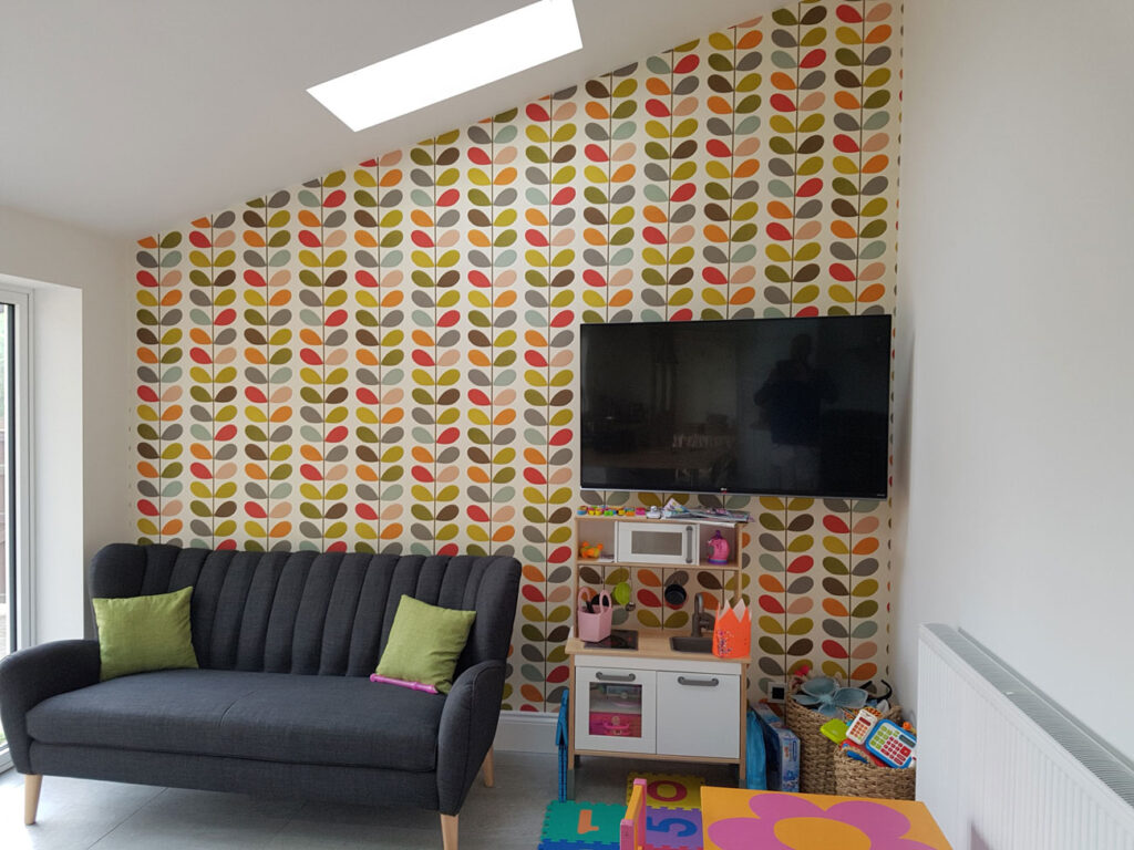 Playroom decorated in Derby and finished with feature wall of Orla Kiely Wallpaper