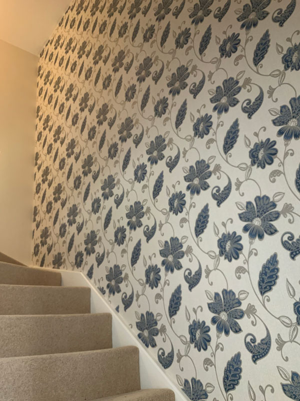 Chellaston, Derby, staircase after redecoration with wallpaper
